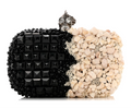 CURATED by Kira Alexander McQueen box clutch with black beads and ivory shells featuring a silver skull kiss lock.