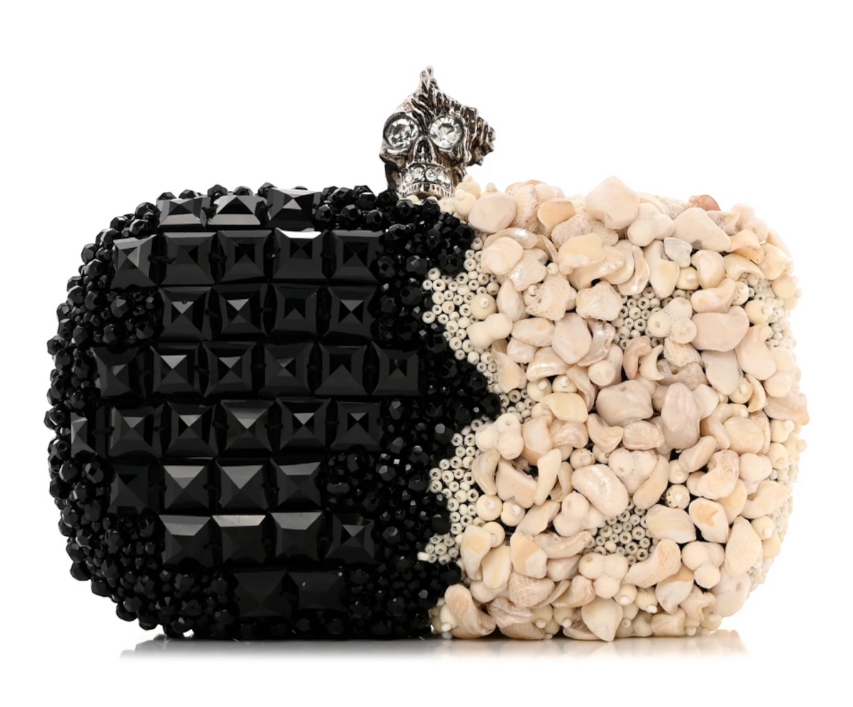 CURATED by Kira Alexander McQueen box clutch with black beads and ivory shells featuring a silver skull kiss lock.