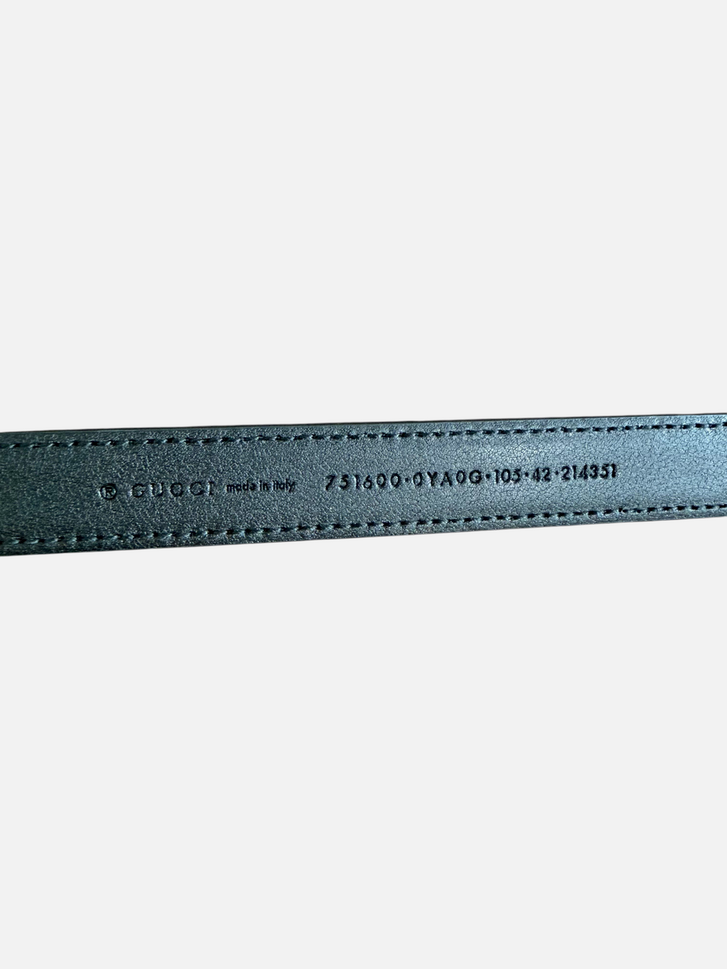 CURATED by Kira Gucci leather belt interior stamp showing brand logo, origin, and size 105 on black cowhide leather