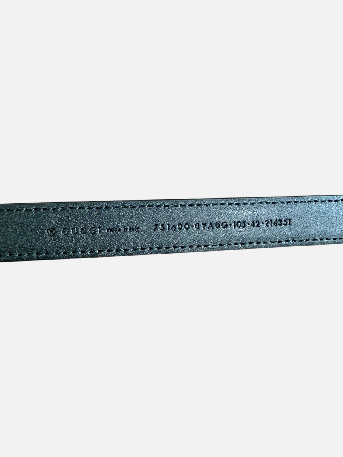 CURATED by Kira Gucci leather belt interior stamp showing brand logo, origin, and size 105 on black cowhide leather