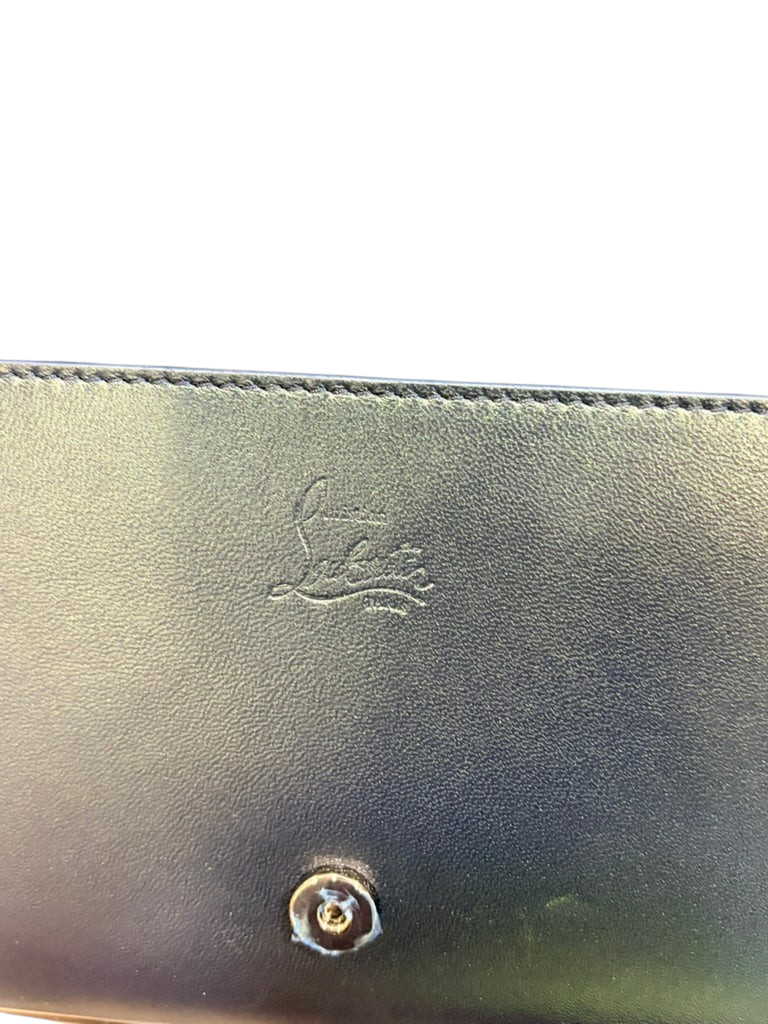 CURATED by Kira Christian Louboutin Paloma black calf leather clutch with embossed logo and metal snap closure