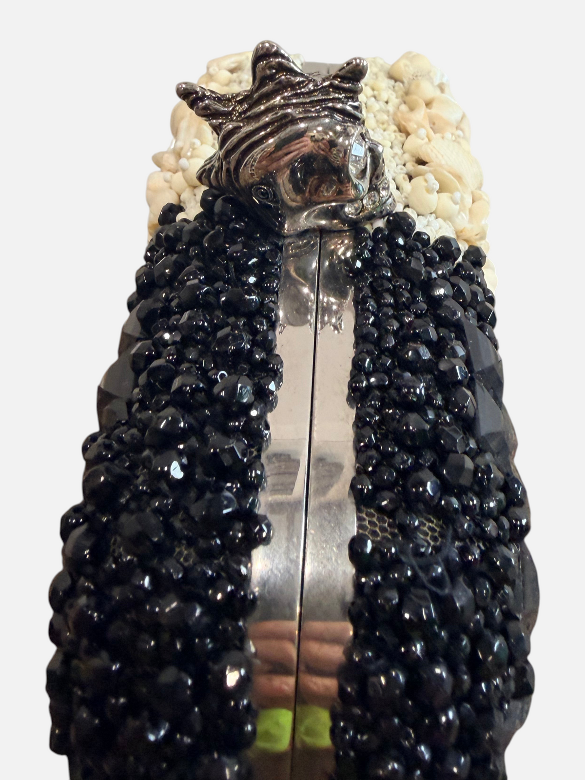 CURATED by Kira Alexander McQueen box clutch with black beads, ivory shells, and a silver skull kiss lock clasp.