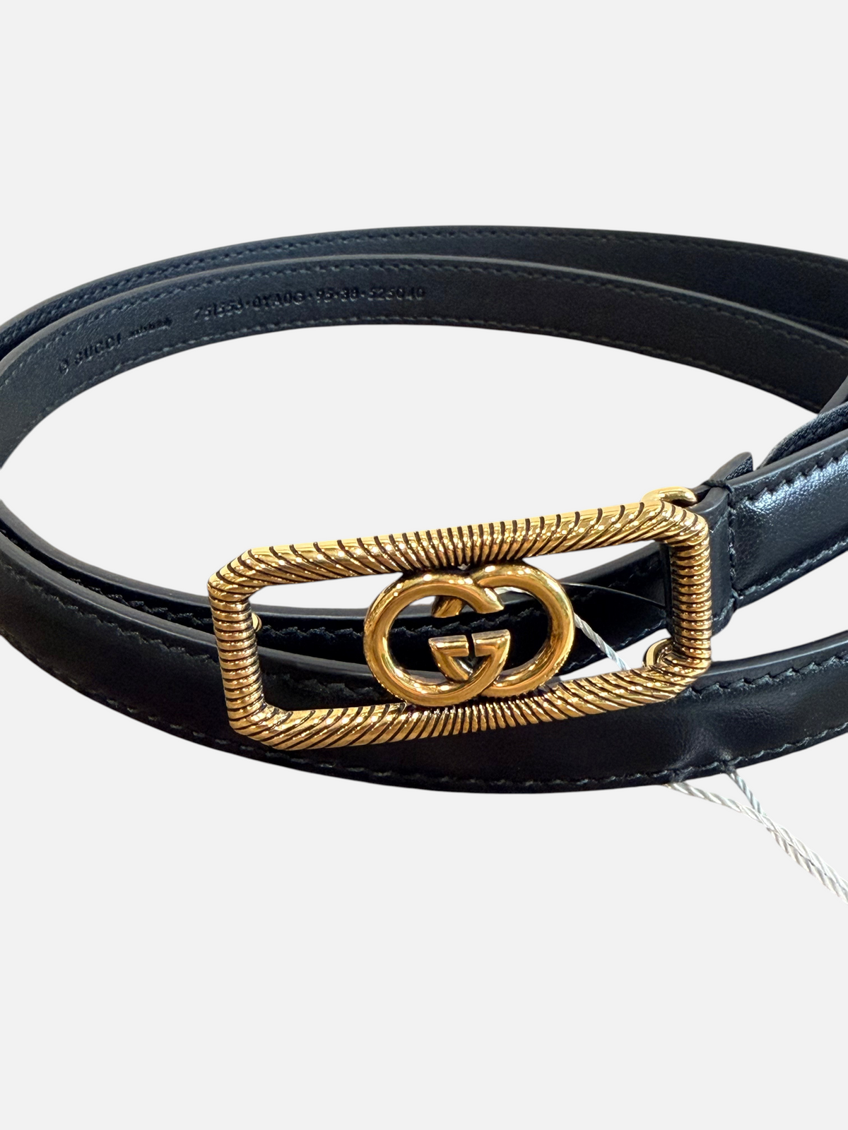 CURATED by Kira Gucci black leather belt featuring a gold-tone rectangular GG logo buckle with rope-style detailing.