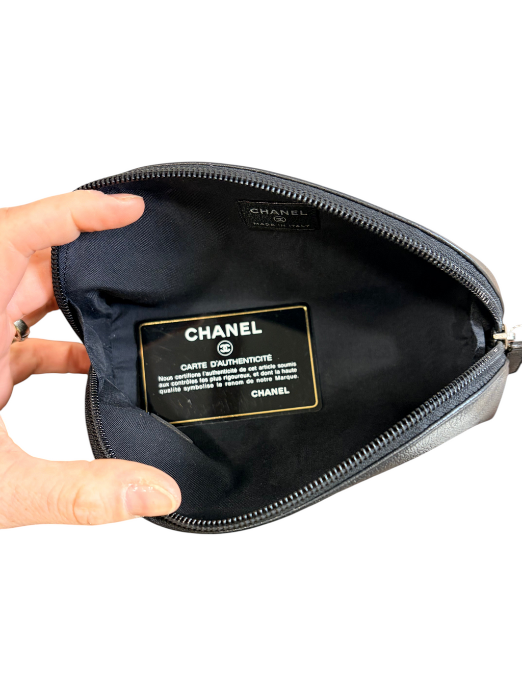 CURATED by Kira Chanel black leather cosmetic pouch interior with authenticity card and woven lining
