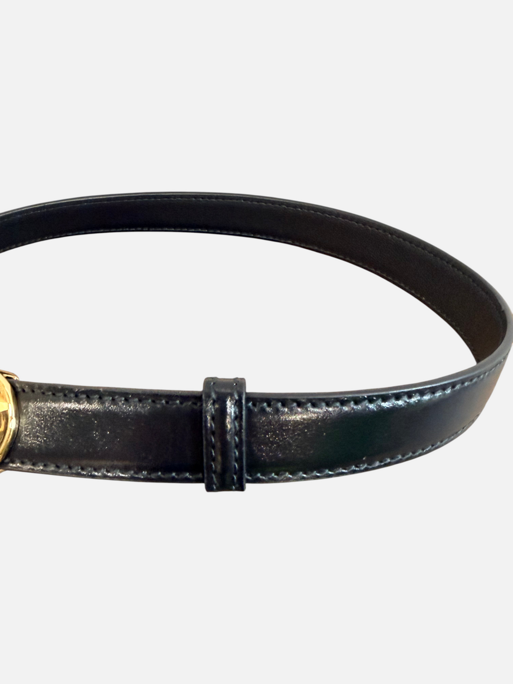 CURATED by Kira black cowhide leather belt with stitched edges and gold tone hardware detail