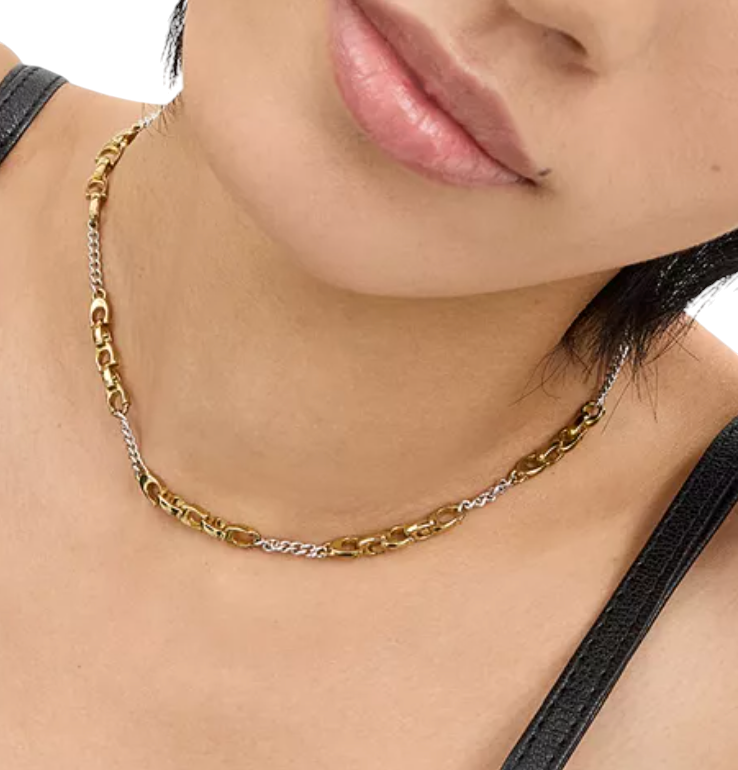 CURATED by Kira Coach two-tone brass mixed chain necklace with signature C links worn on a model