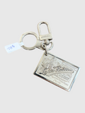 CURATED by Kira pre-owned Louis Vuitton Traveling Requisites silver-tone metal keychain bag charm