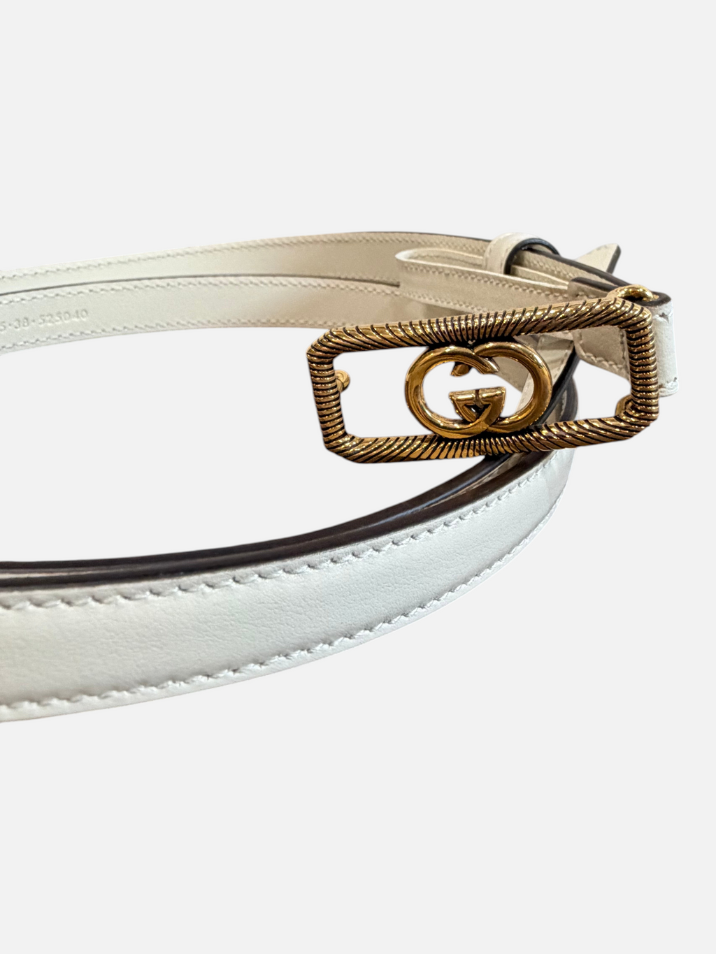 CURATED by Kira Gucci GG buckle leather belt in mystic white with a textured gold-tone rectangular frame buckle.