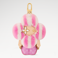 CURATED by Kira Louis Vuitton Vivienne Fashionista bag charm in pink mink fur and leather with gold-toned hardware.