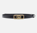CURATED by Kira Gucci black leather belt featuring a rectangular gold-tone GG logo buckle with ribbed detailing.