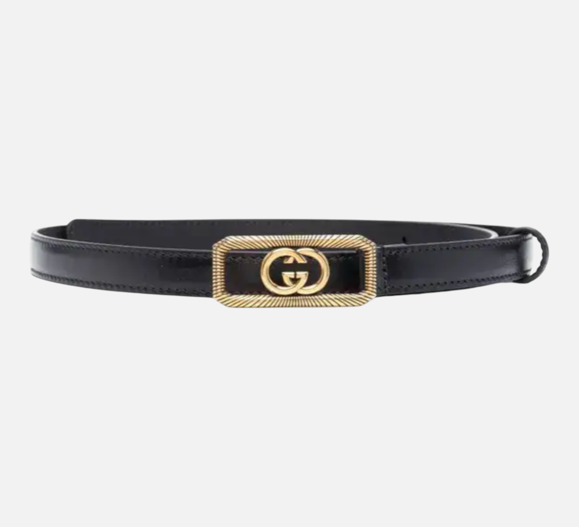 CURATED by Kira Gucci black leather belt featuring a rectangular gold-tone GG logo buckle with ribbed detailing.