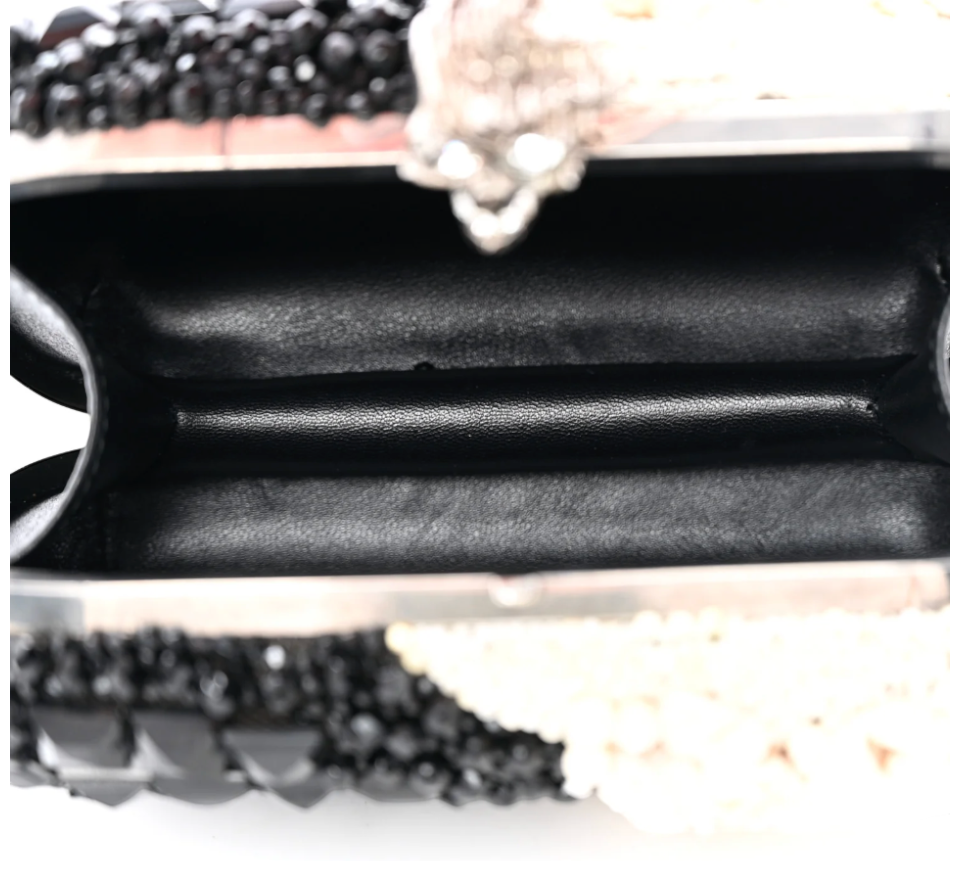 Interior view of CURATED by Kira Alexander McQueen black silk shell and bead clutch with leather lining