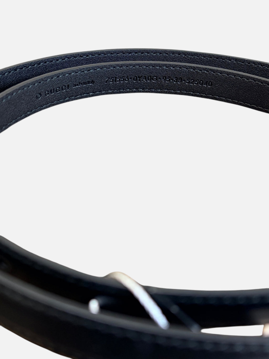 CURATED by Kira Gucci black leather belt interior detail showing embossed serial number and size 95