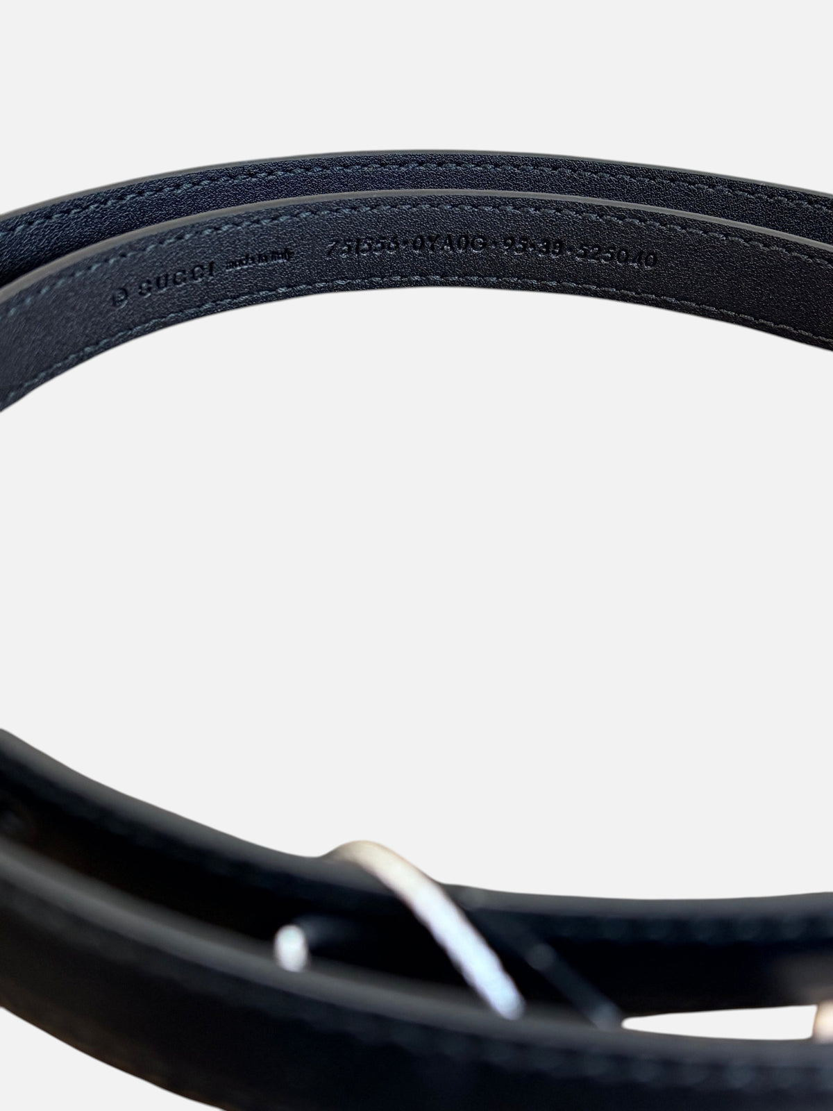 CURATED by Kira Gucci black leather belt interior detail showing embossed serial number and size 95