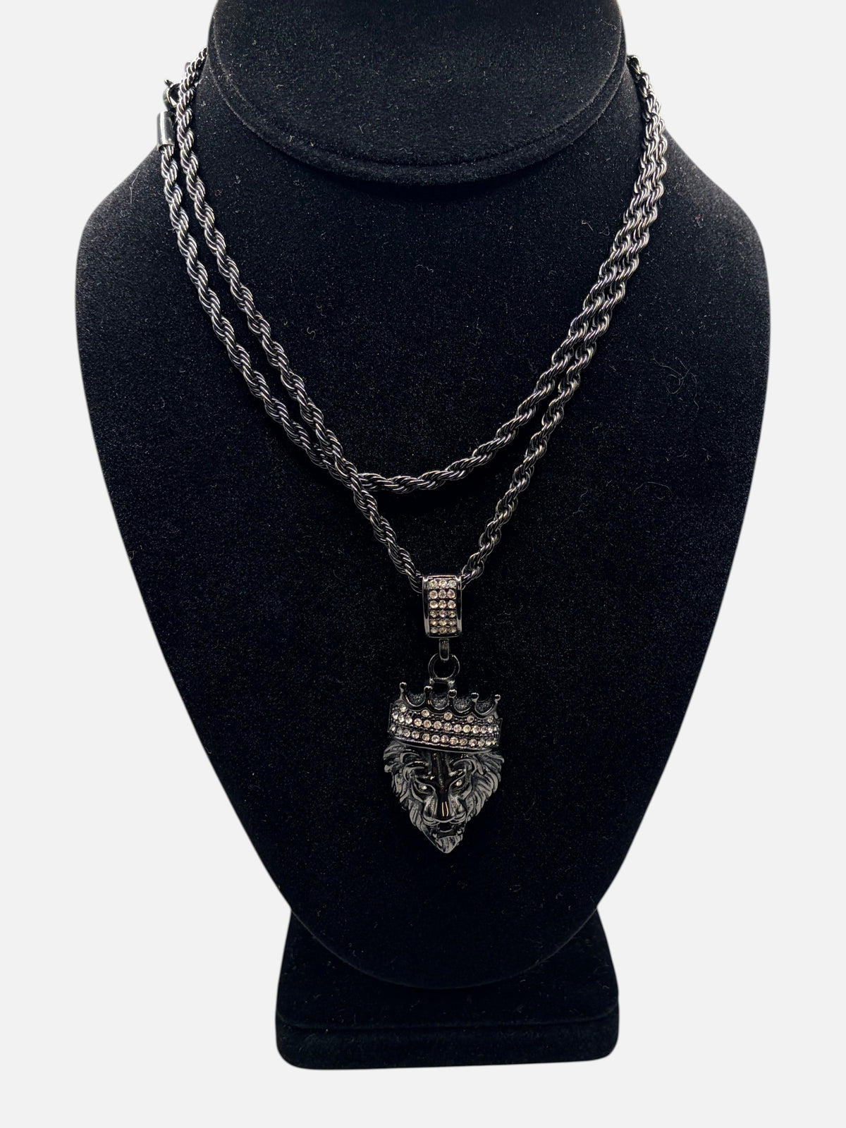 CURATED by Kira black stainless steel rope chain necklace featuring a lion head pendant with a diamond-set crown.