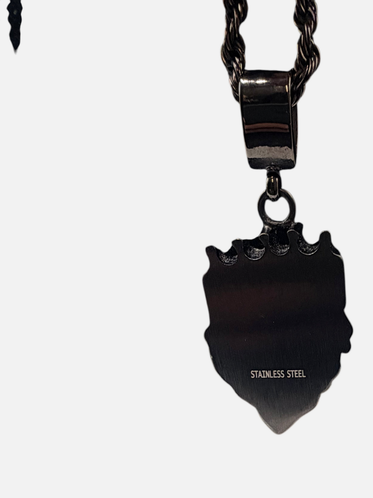 CURATED by Kira black stainless steel lion pendant necklace showing the smooth back with stainless steel engraving