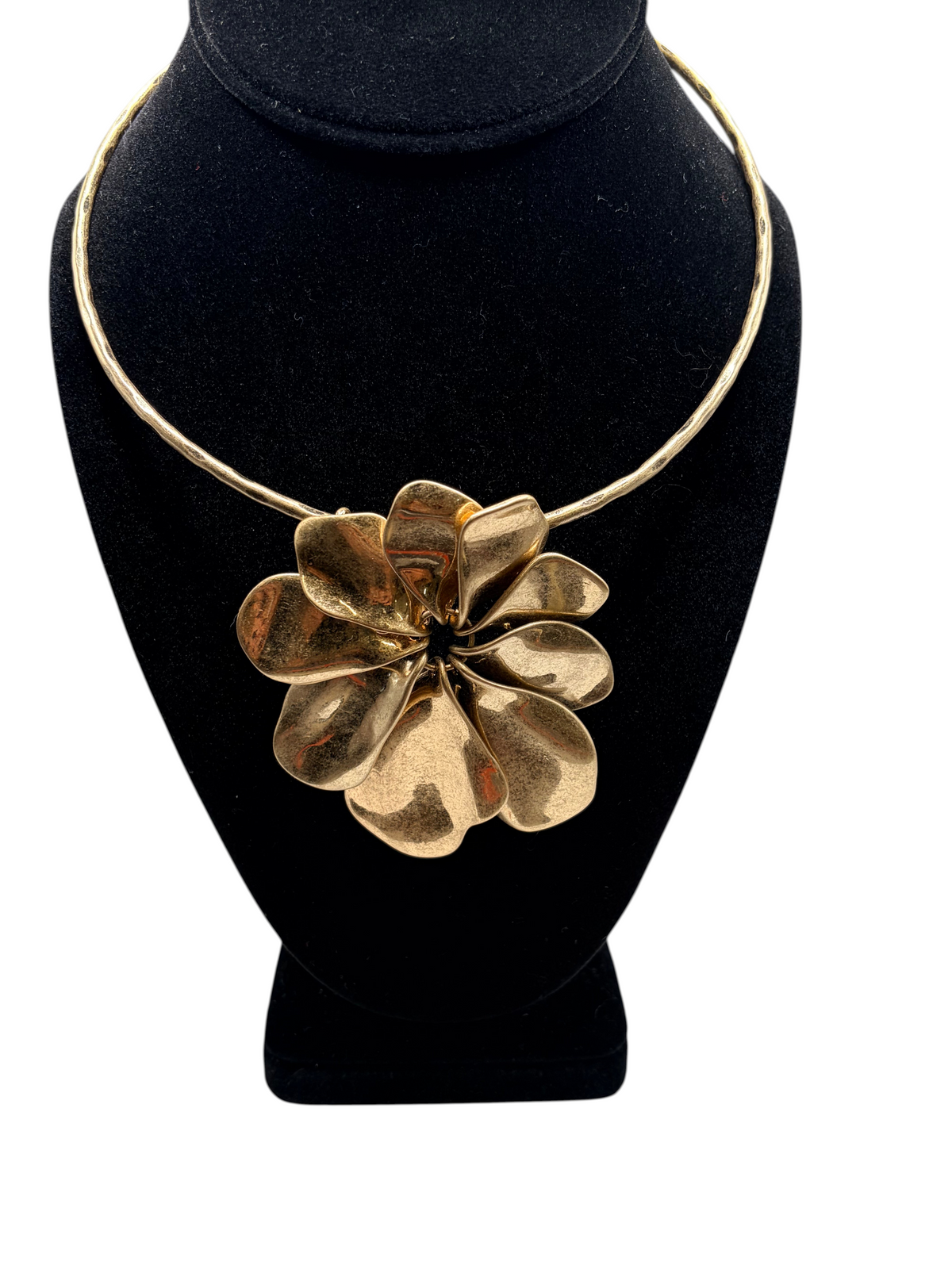 CURATED by Kira gold-plated sculptural flower pendant collar necklace on a black display bust