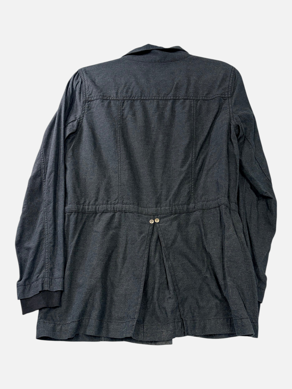 Back view of CURATED by Kira cabi charcoal gray cotton blend utility jacket with a cinched waist and button detail.