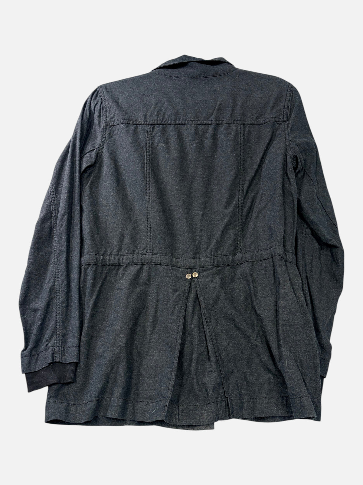 Back view of CURATED by Kira cabi charcoal gray cotton blend utility jacket with a cinched waist and button detail.