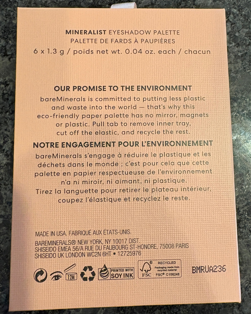 Cardboard packaging with text on a dark surface