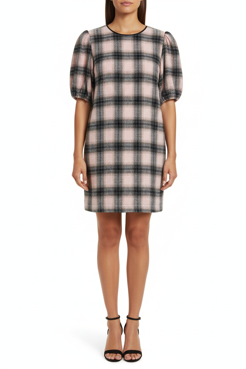 Plaid dress on a hanger against a white background