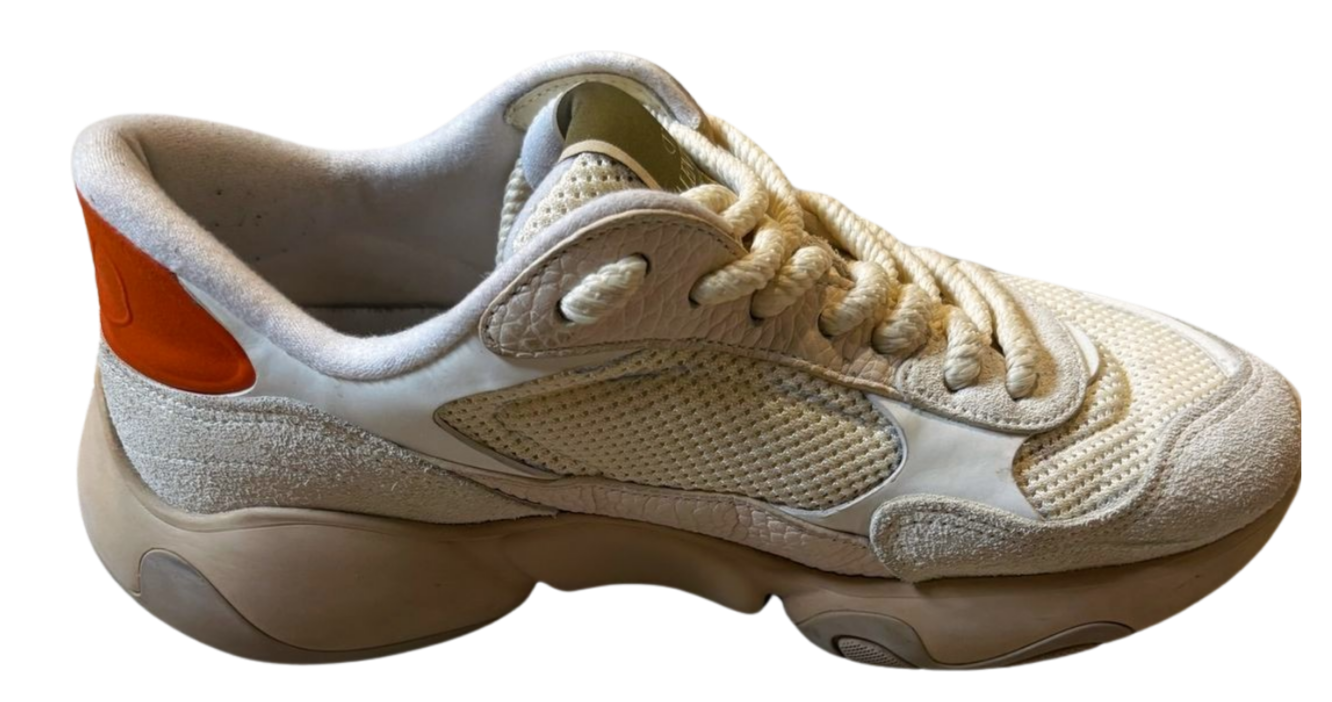 Beige sneaker with a white sole on a white background