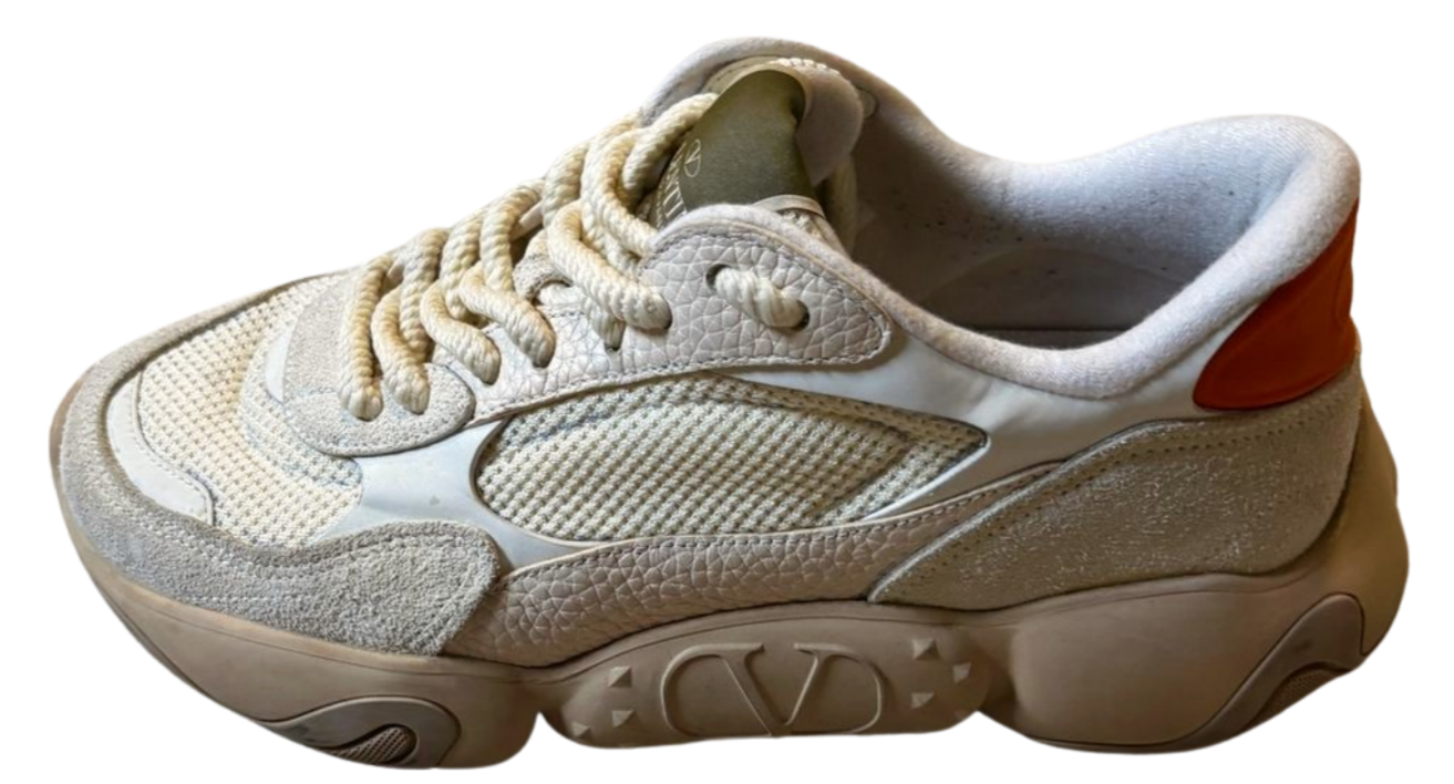Beige sneaker with a white sole on a white background