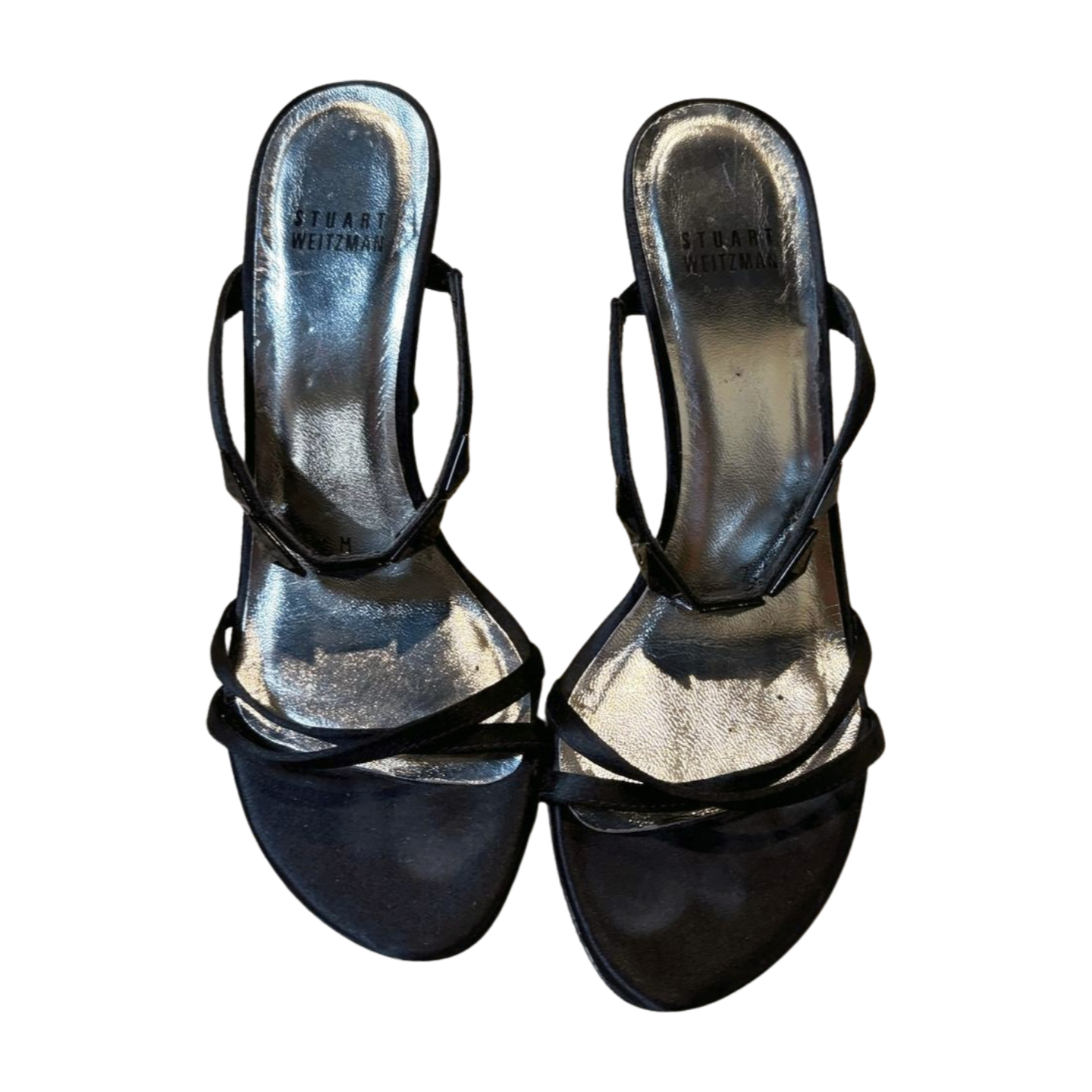 Pair of black high-heeled shoes on a white background