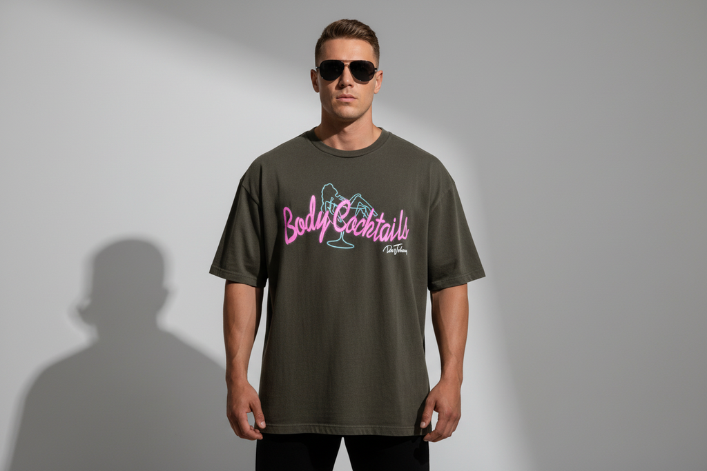 Brown t-shirt with pink text on a hanger against a white background