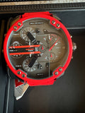Red and black watch with detailed face on a dark background