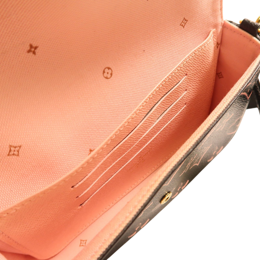 Interior view of CURATED by Kira Louis Vuitton Felicie Strap & Go pochette with pink lining and card slots
