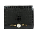 MIU MIU embossed patent leather bi-fold compact wallet