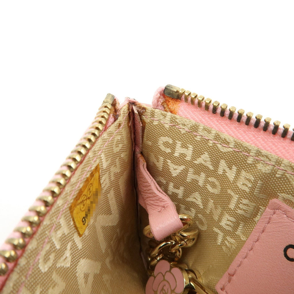 CURATED by Chanel pink quilted leather zip-around card holder with floral charm and gold hardware.