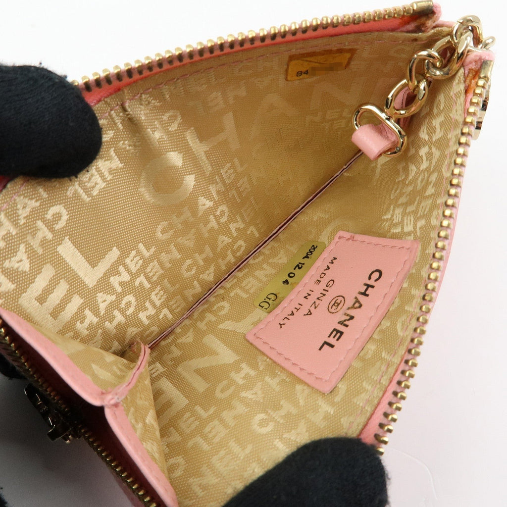 CURATED by Chanel pink quilted leather zip around coin case with gold hardware and floral charm.