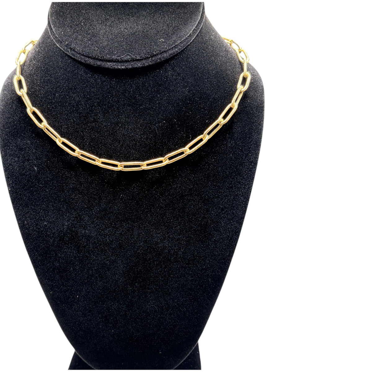 CURATED by Kira 18k Italian gold paperclip chain necklace displayed on a black velvet jewelry bust