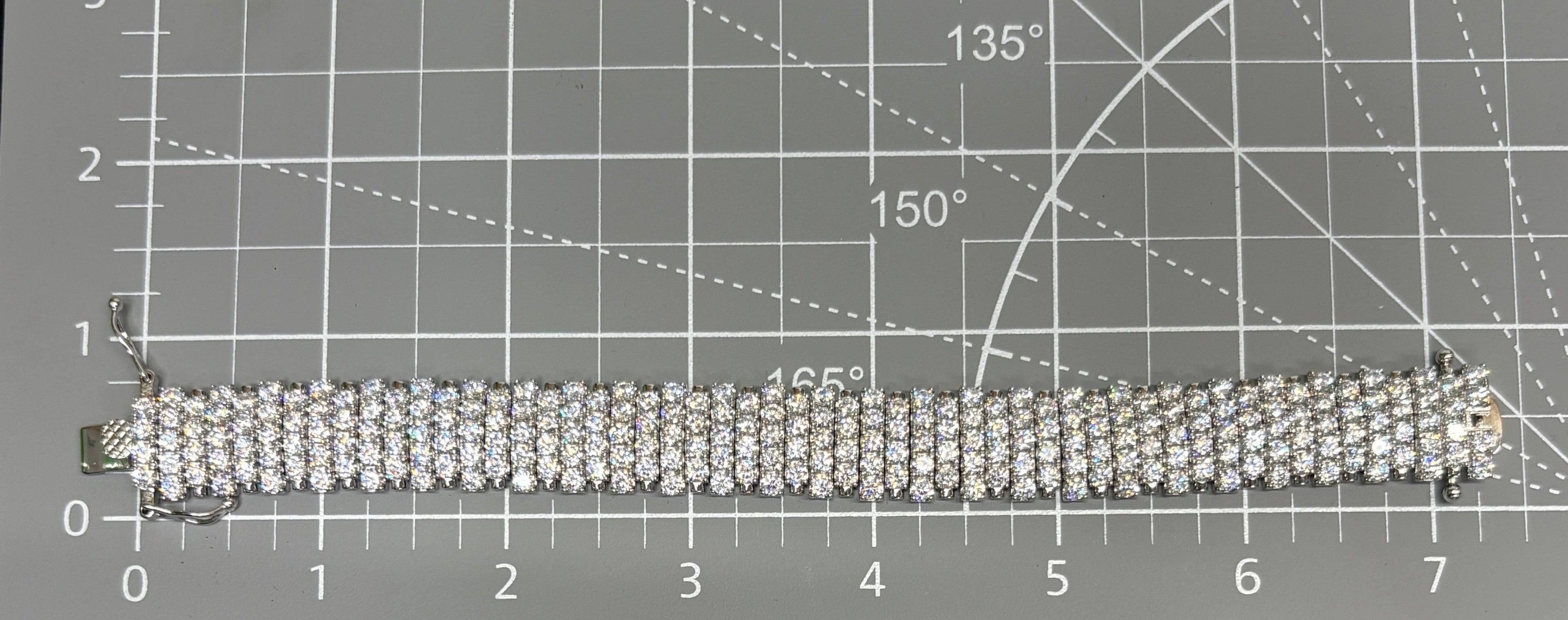 CURATED by Kira wide 5-row sterling silver tennis bracelet featuring sparkling round-cut cubic zirconia stones.