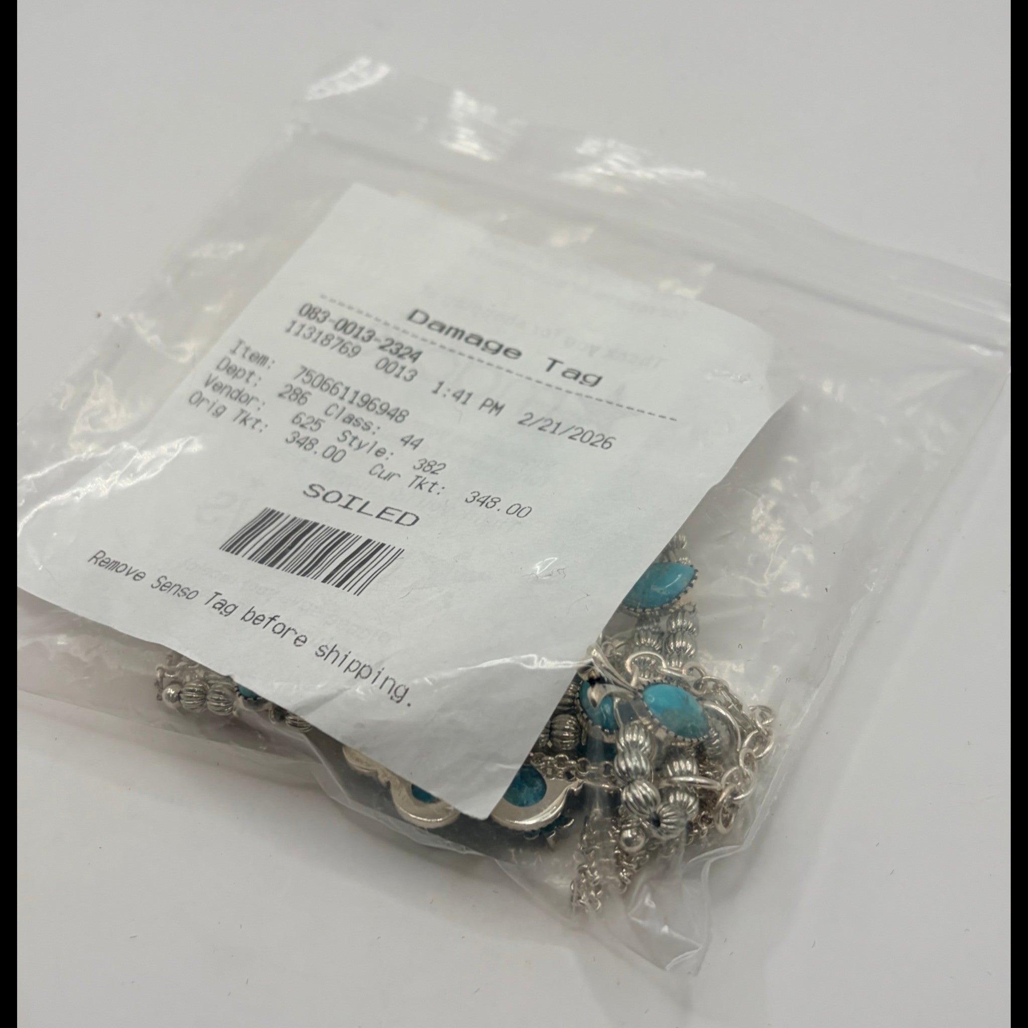 CURATED by Kira Barse sterling silver squash blossom necklace with teal turquoise stones in protective plastic bag
