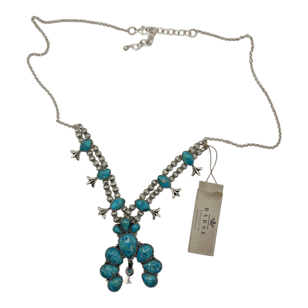 CURATED by Kira Barse sterling silver squash blossom necklace featuring teal turquoise stones on a delicate chain.