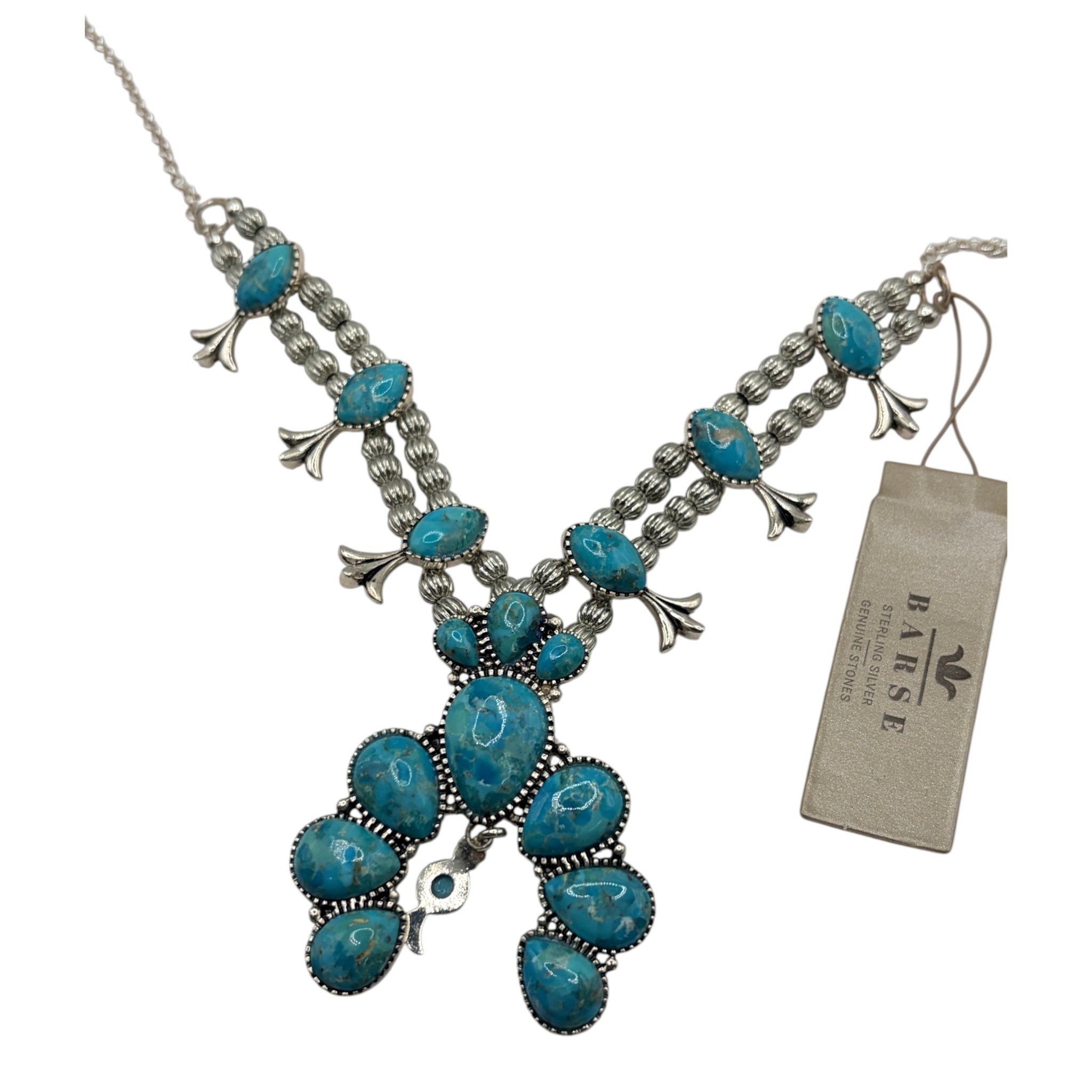 CURATED by Kira Barse sterling silver squash blossom necklace featuring teal turquoise stones and intricate metalwork