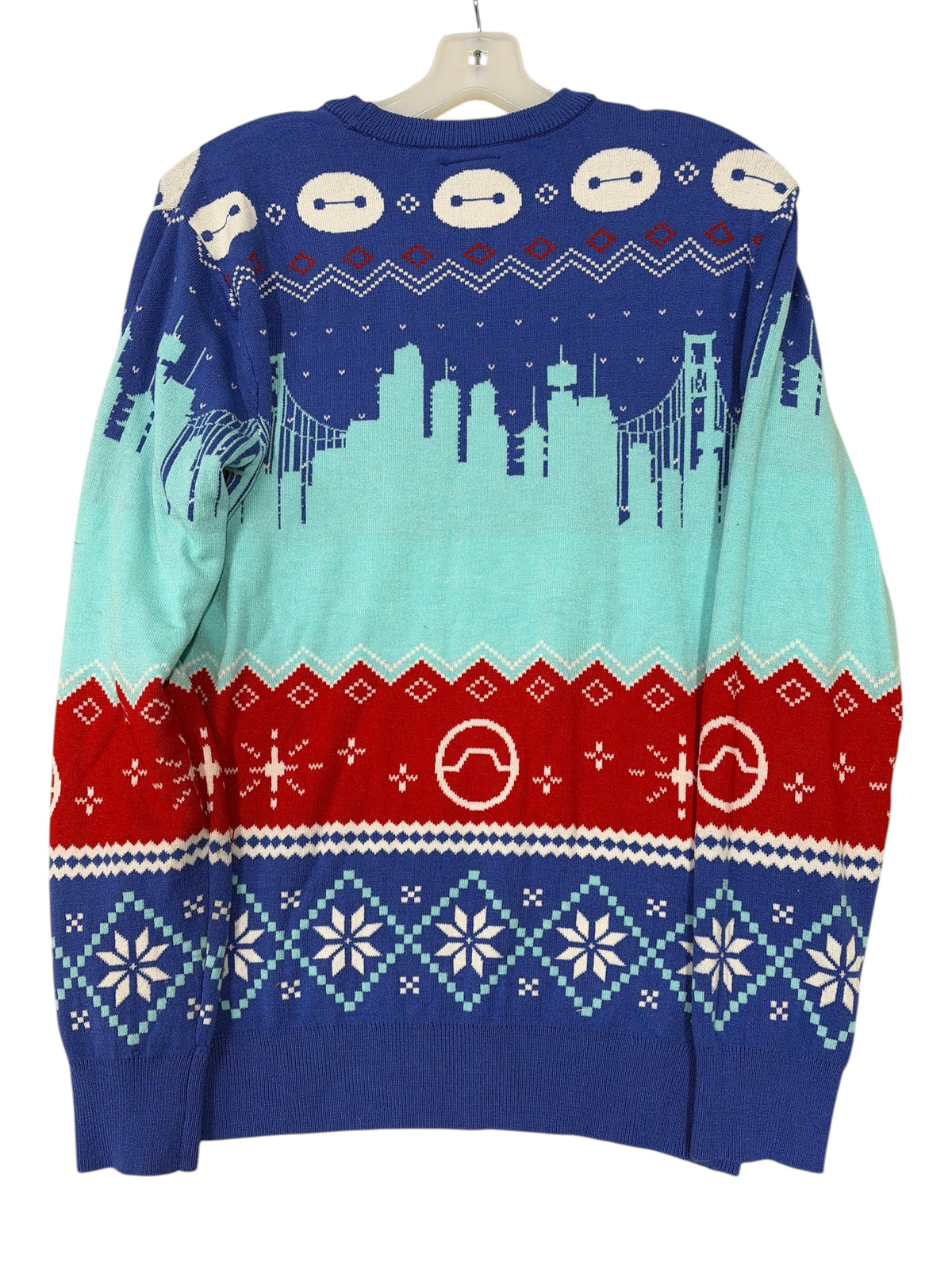 CURATED by Kira Disney Parks Big Hero 6 holiday sweater featuring Baymax icons, San Fransokyo skyline, and snowflakes.