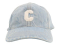 CURATED by Kira light blue denim baseball cap featuring a white embroidered C logo on the front