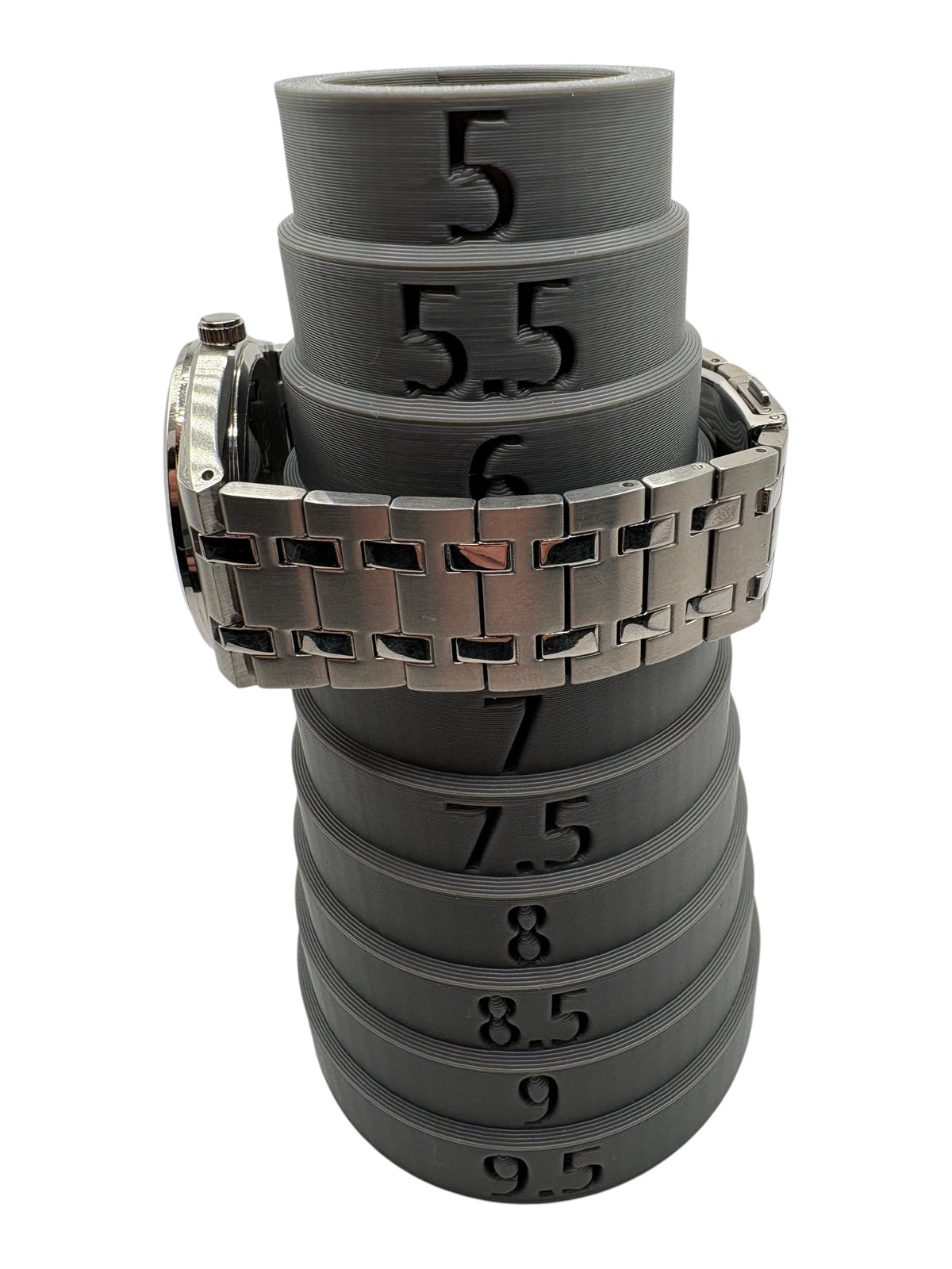 CURATED by Kira Calvin Klein Motion men's watch with silver stainless steel bracelet on a grey ring sizing tool