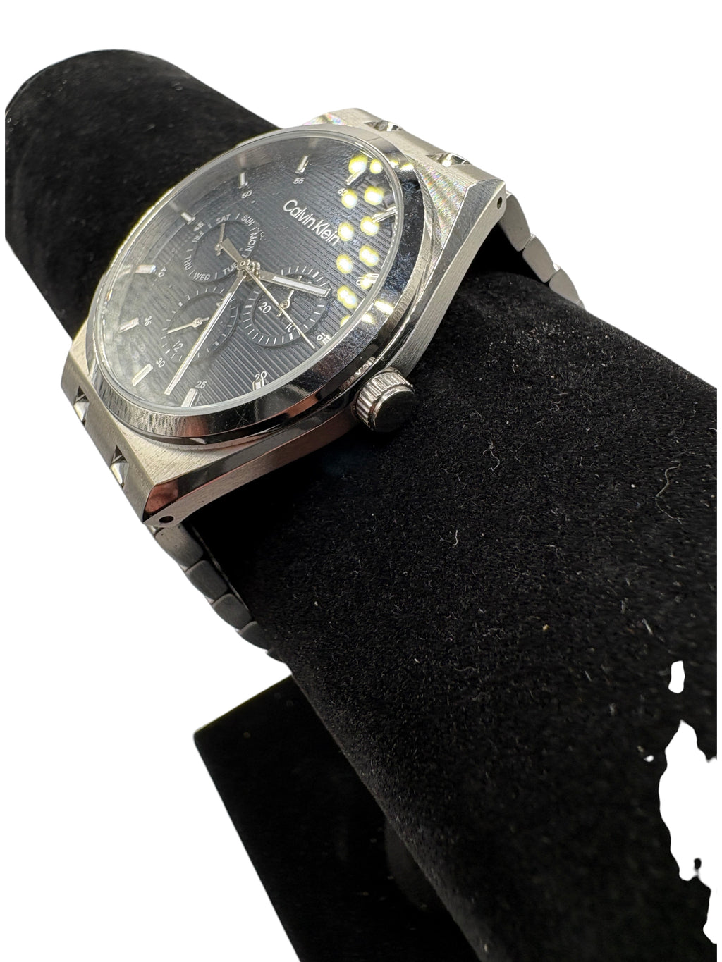 CURATED by Kira Calvin Klein Motion quartz watch with a textured navy blue dial and silver stainless steel bracelet.