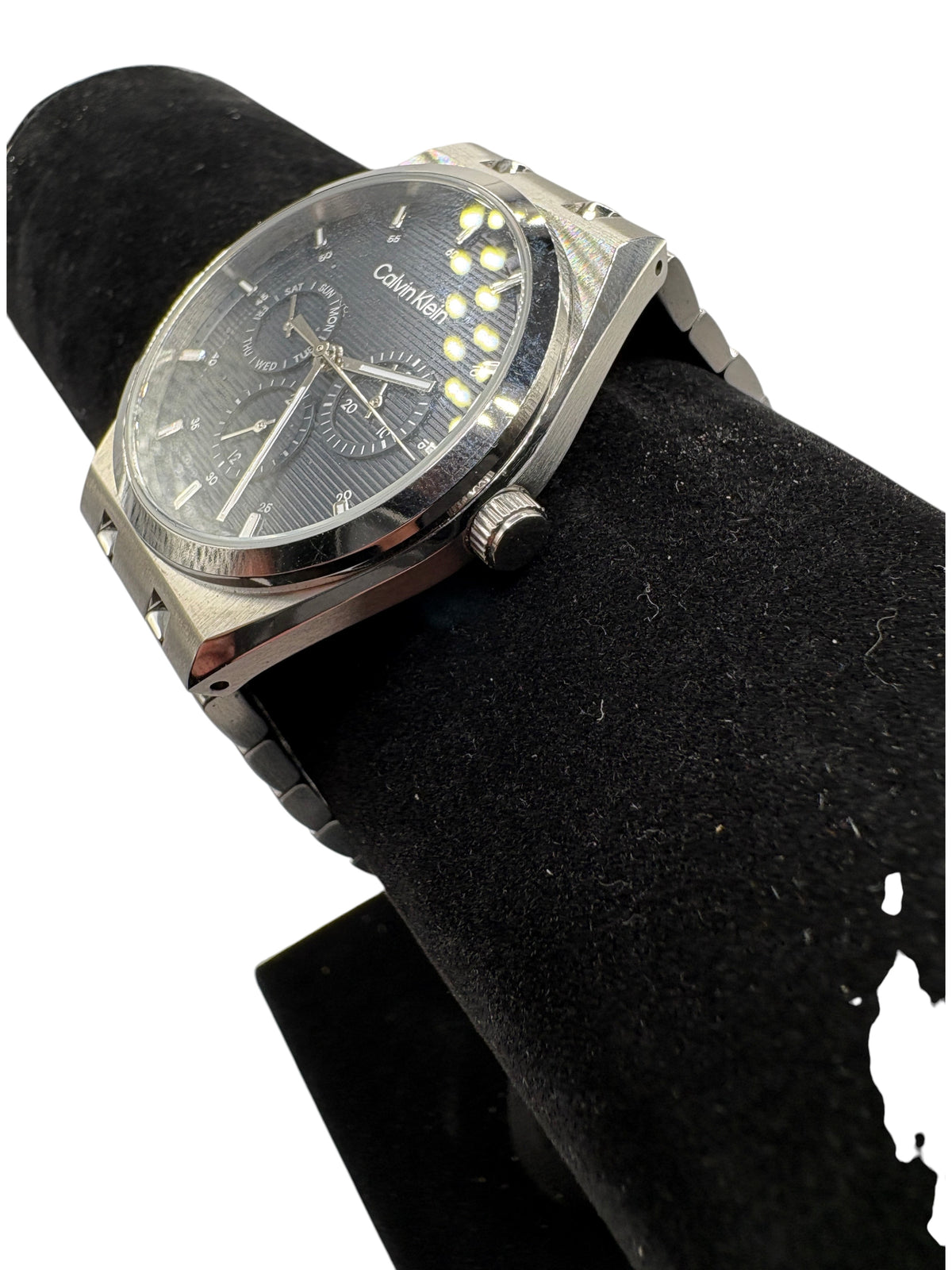 CURATED by Kira Calvin Klein Motion quartz watch with a textured navy blue dial and silver stainless steel bracelet.