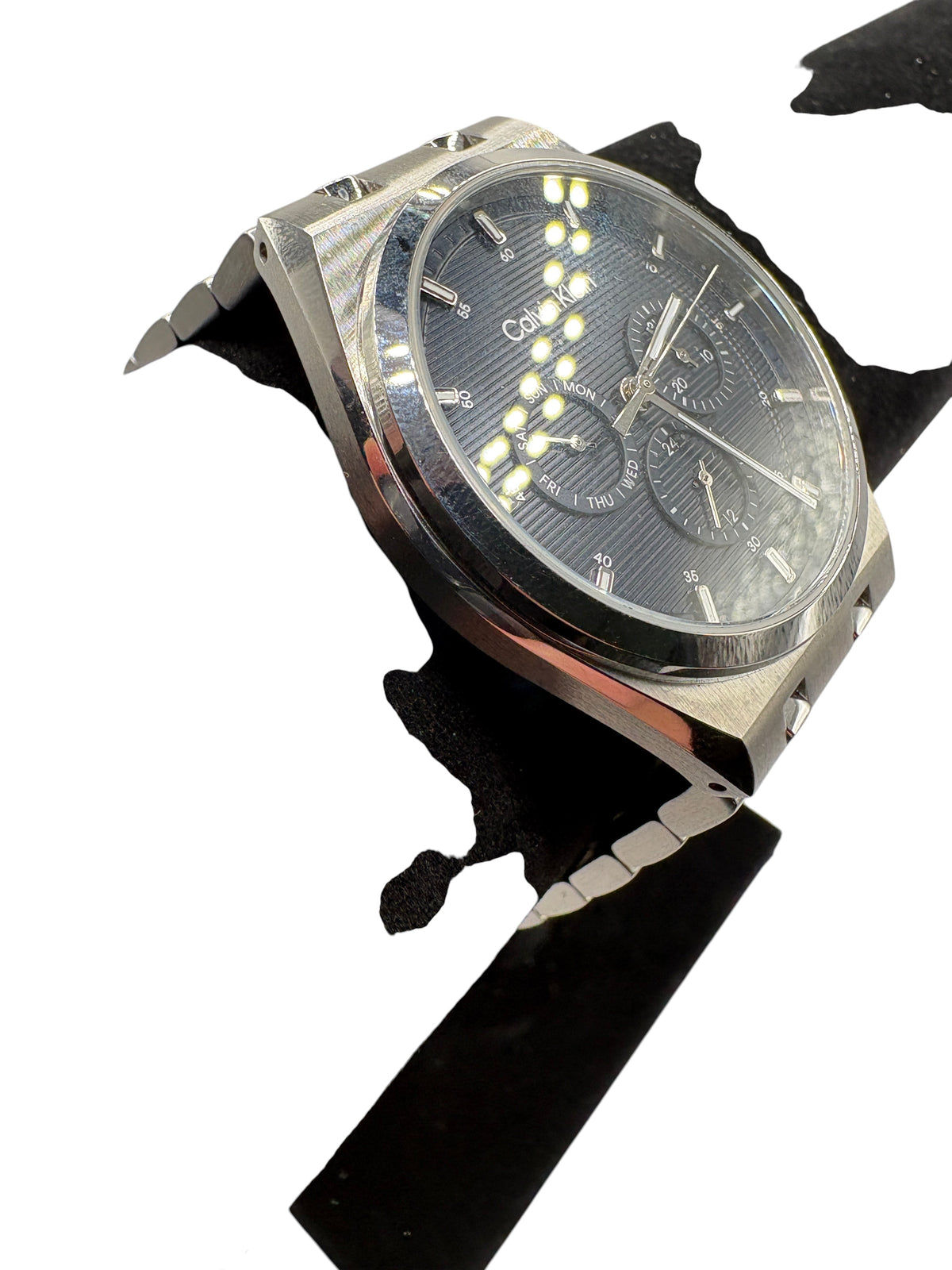 CURATED by Kira Calvin Klein Motion watch featuring a textured navy blue dial and silver stainless steel bracelet