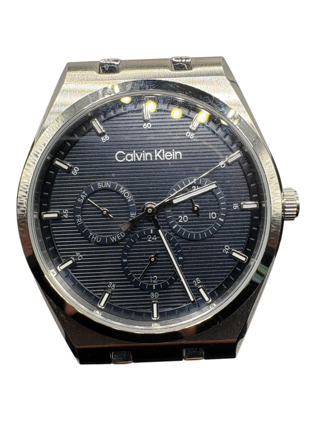 CURATED by Kira Calvin Klein Motion men's watch with a textured navy blue dial and silver stainless steel case.