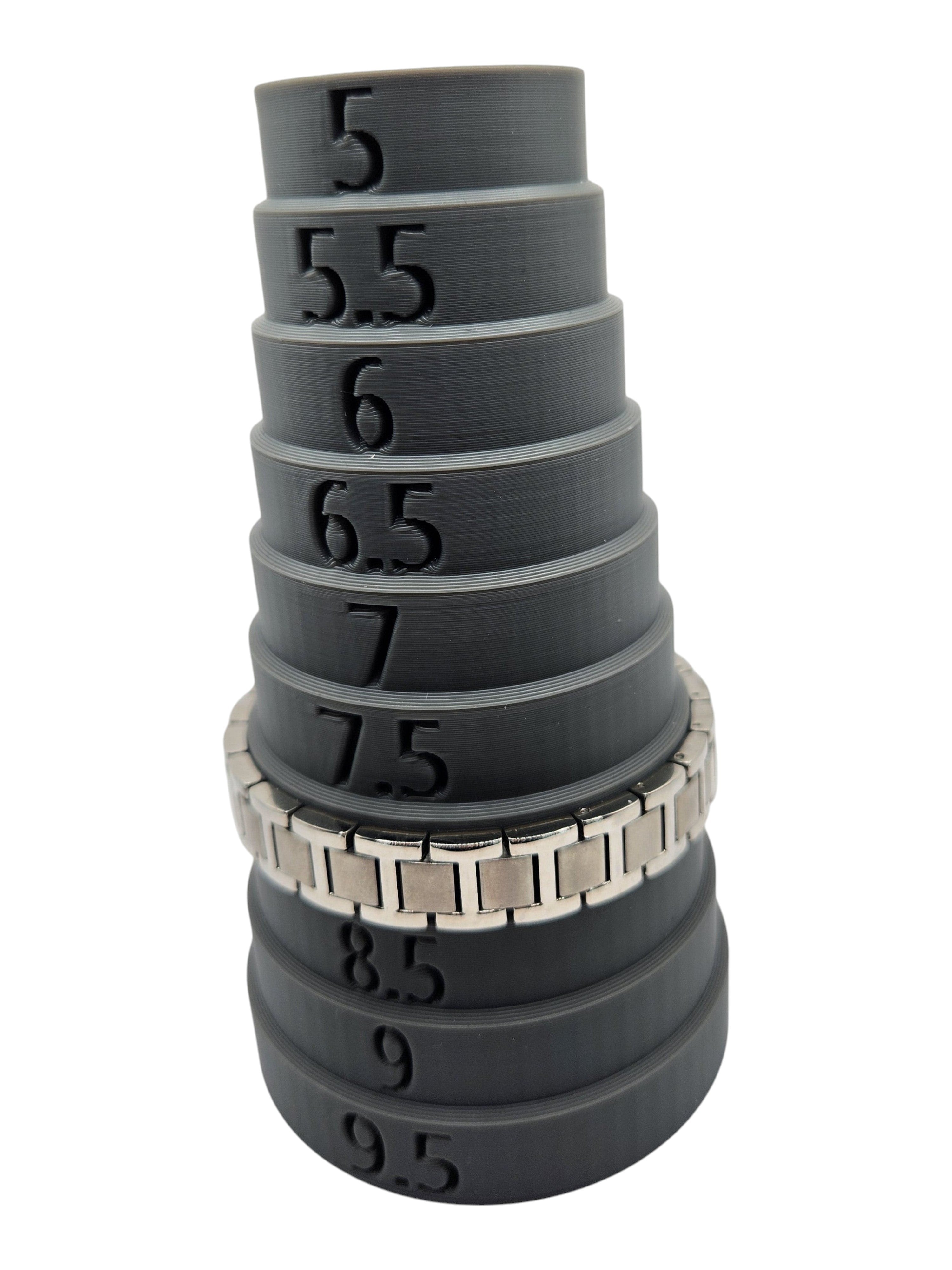 CURATED by Kira Caravelle silver-tone stainless steel link bracelet on a grey sizing mandrel