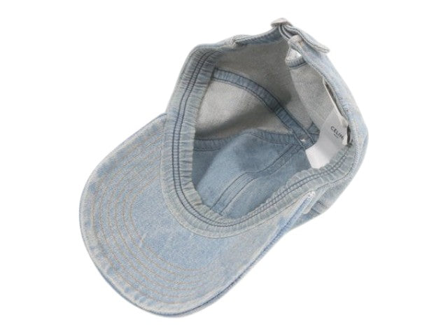 CURATED by Kira Celine blue denim baseball cap, size M, showing interior label and stitching details.