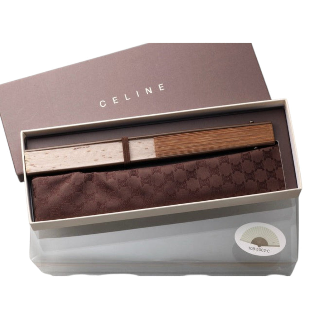 CURATED by Kira beige Celine folding fan with wooden handle, branded storage pouch, and presentation box