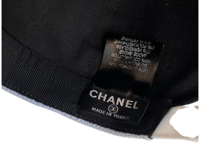 CURATED by Kira Chanel denim hat interior label showing brand logo and material composition in very good condition